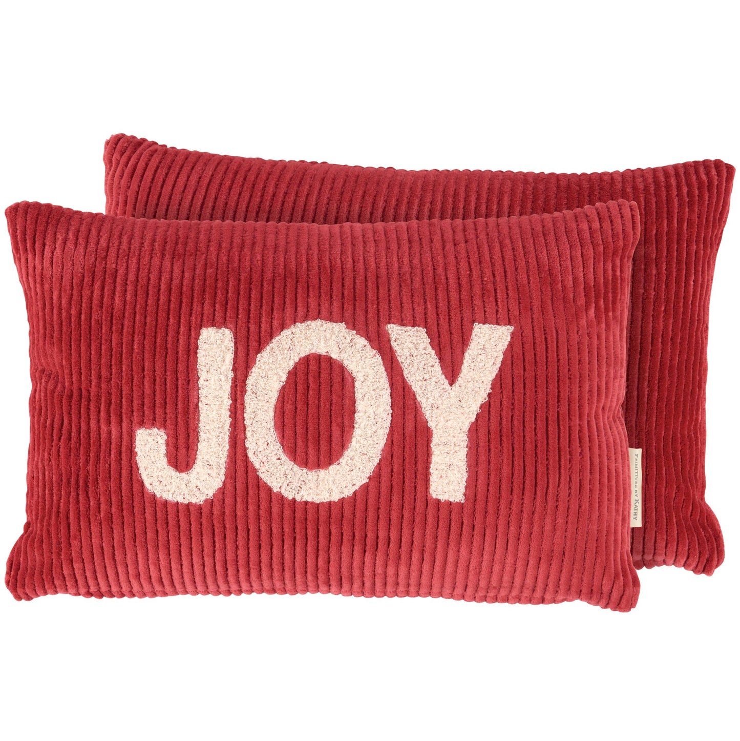 Red pillows with 'JOY' text on a white background
