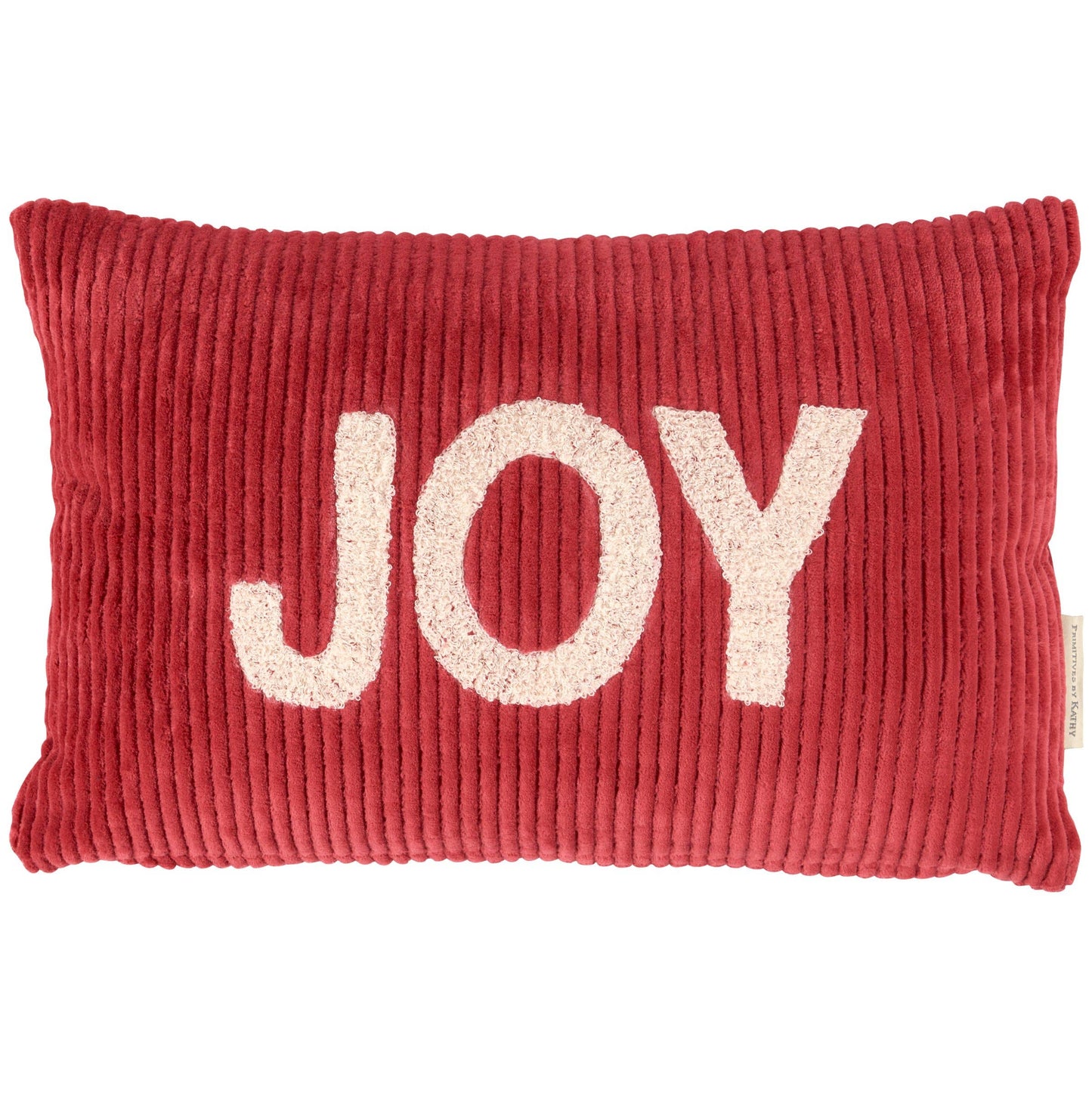 Red pillow with 'JOY' in white letters on a white background
