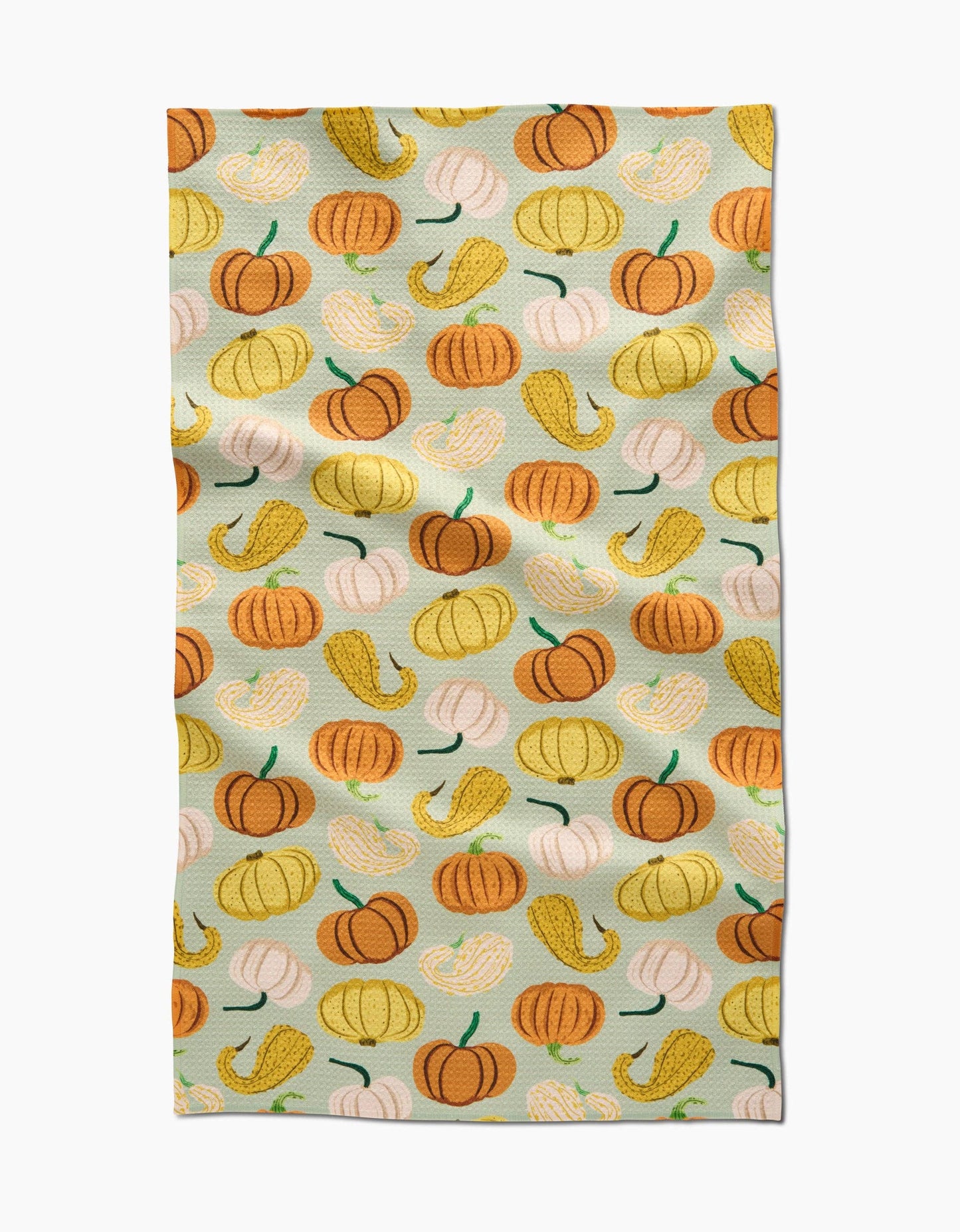 Tea towel with colorful pumpkin pattern on a light blue background