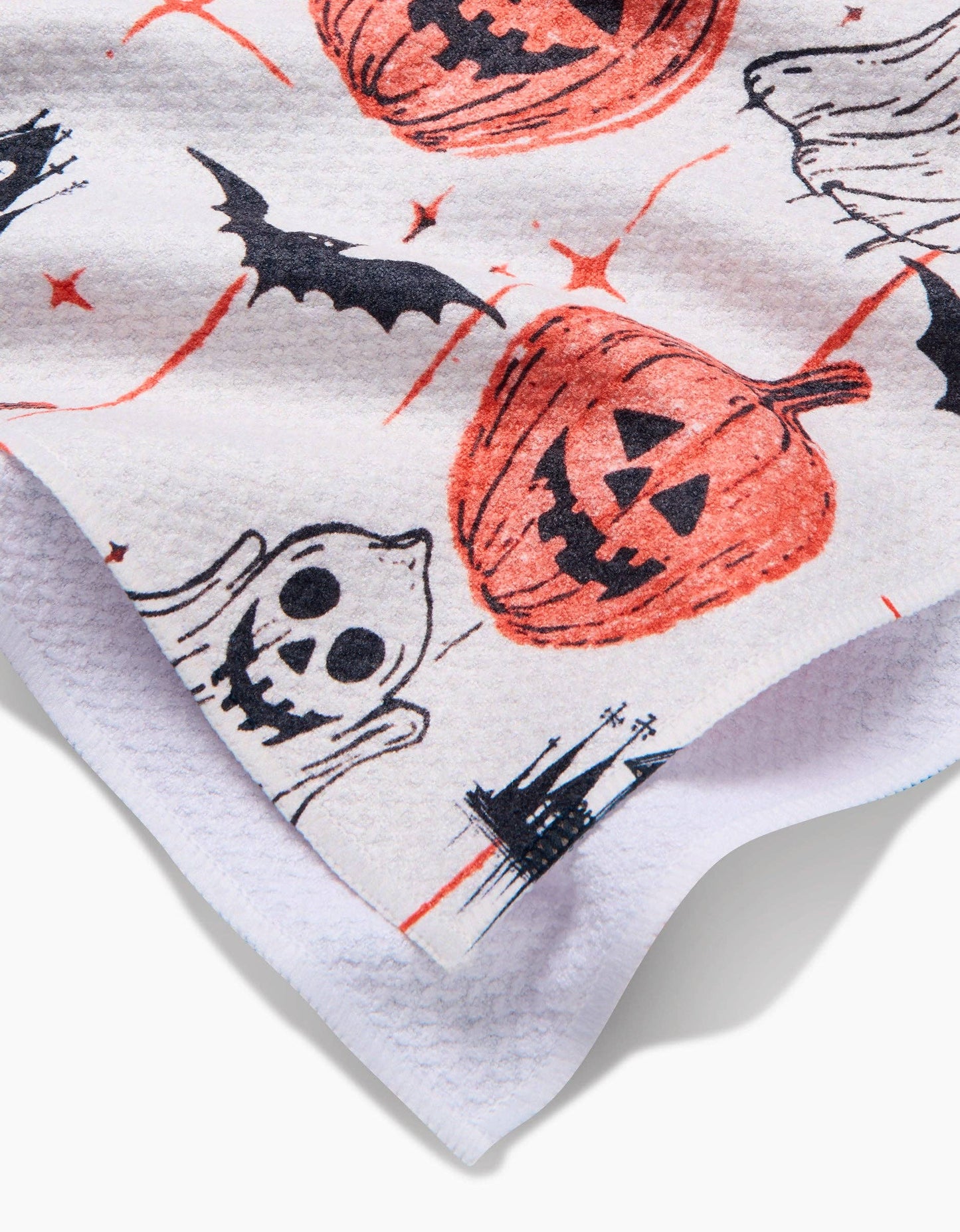 Halloween-themed fabric with pumpkins, ghosts, and bats on a white background