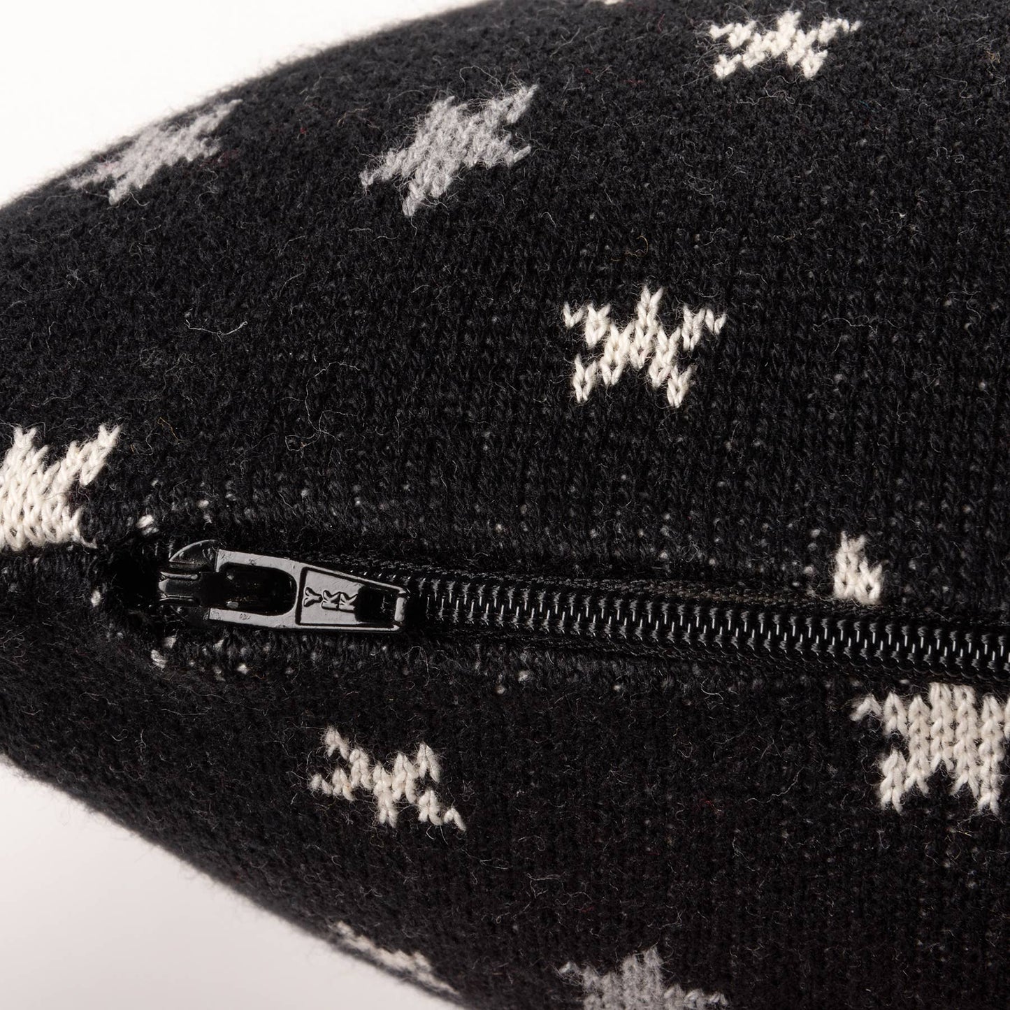 Black pouch with white pattern and zipper on a white background