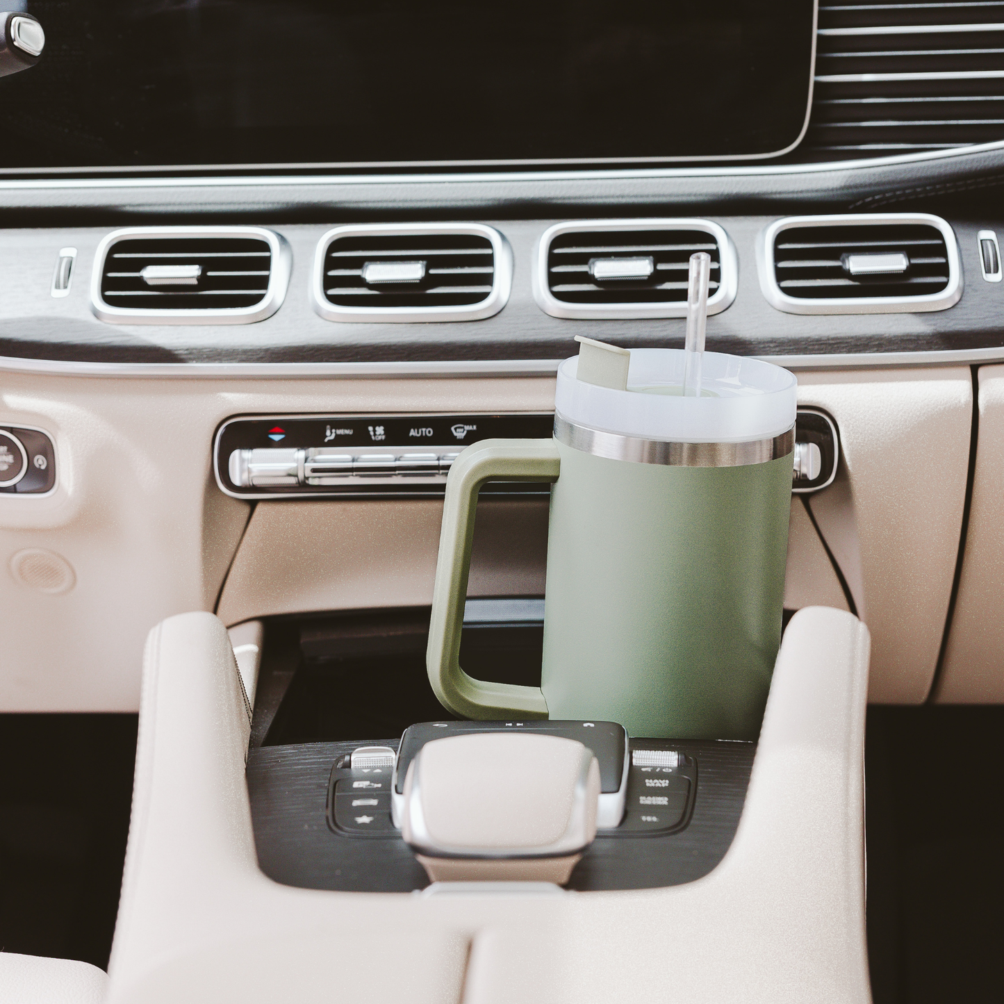 Green cup holder with a green cup in a car's cup holder