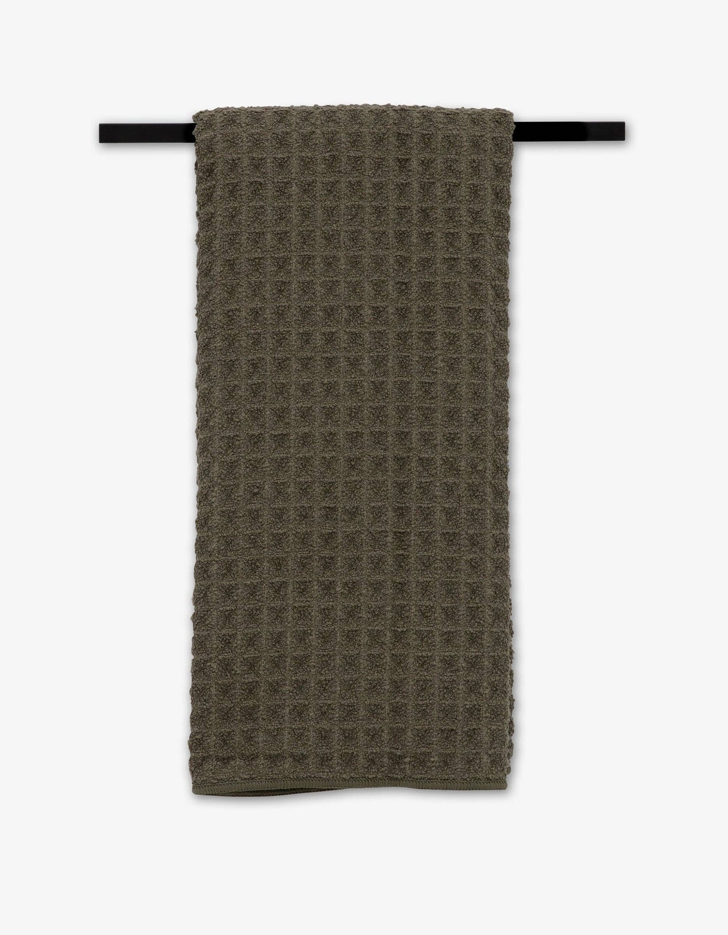 Forest Green Hand Towel hanging from black towel bar on white background