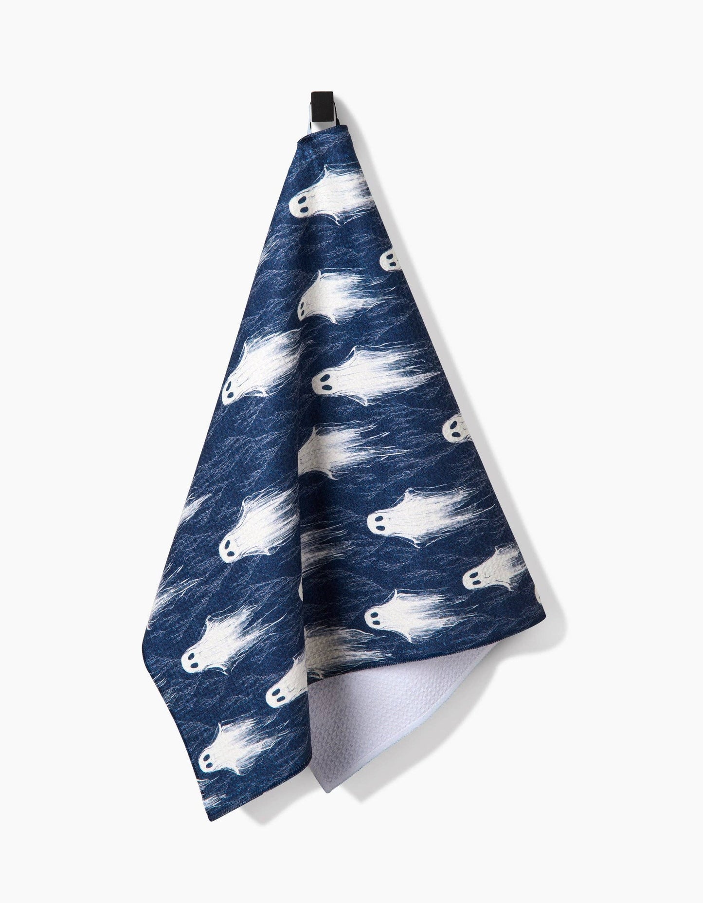 Navy blue towel with white fish pattern on a white background