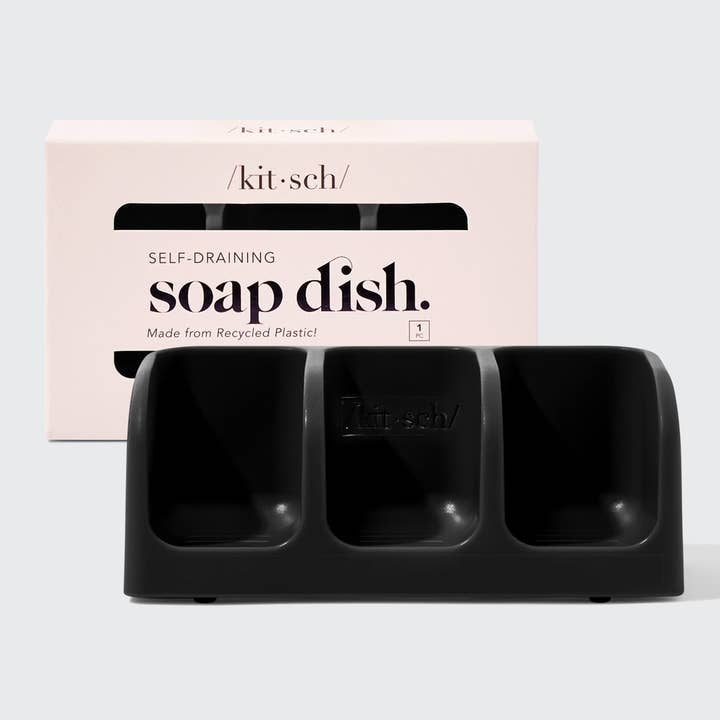 Black soap dish with 'kit·sch' packaging on a white background