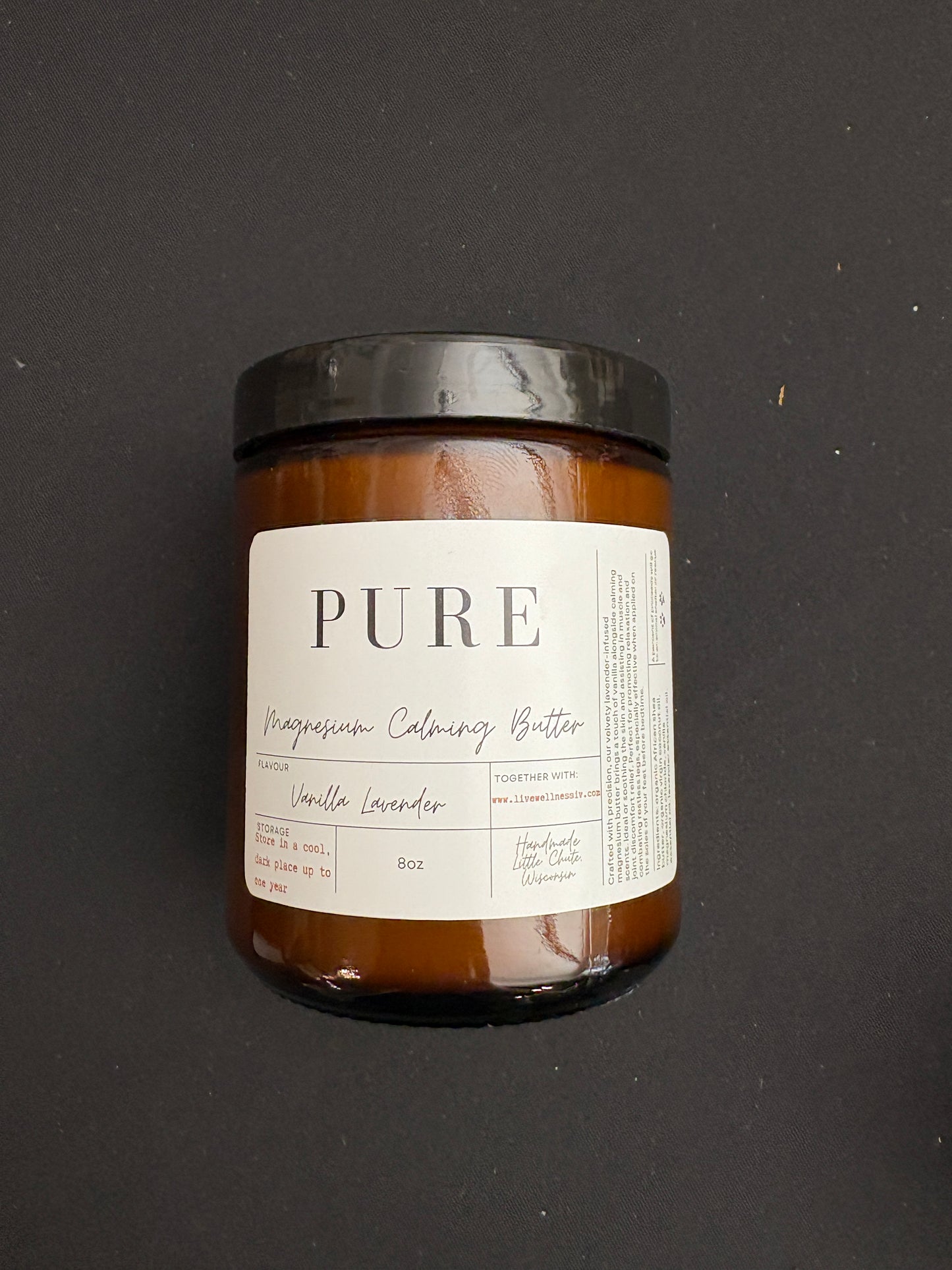 A Jar of Magnesium Calming Butter Vanilla Lavender Scent on dark background