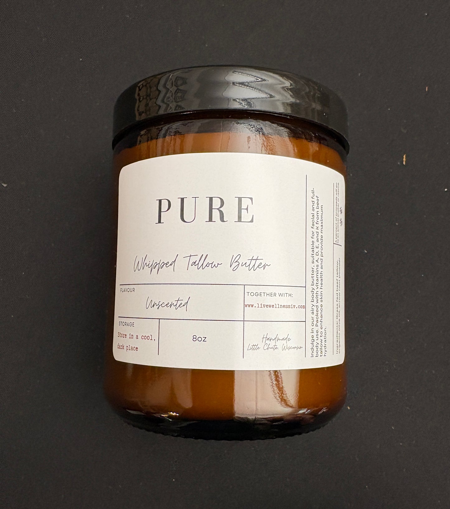 A Jar of Whipped Tallow Butter unscented on black background