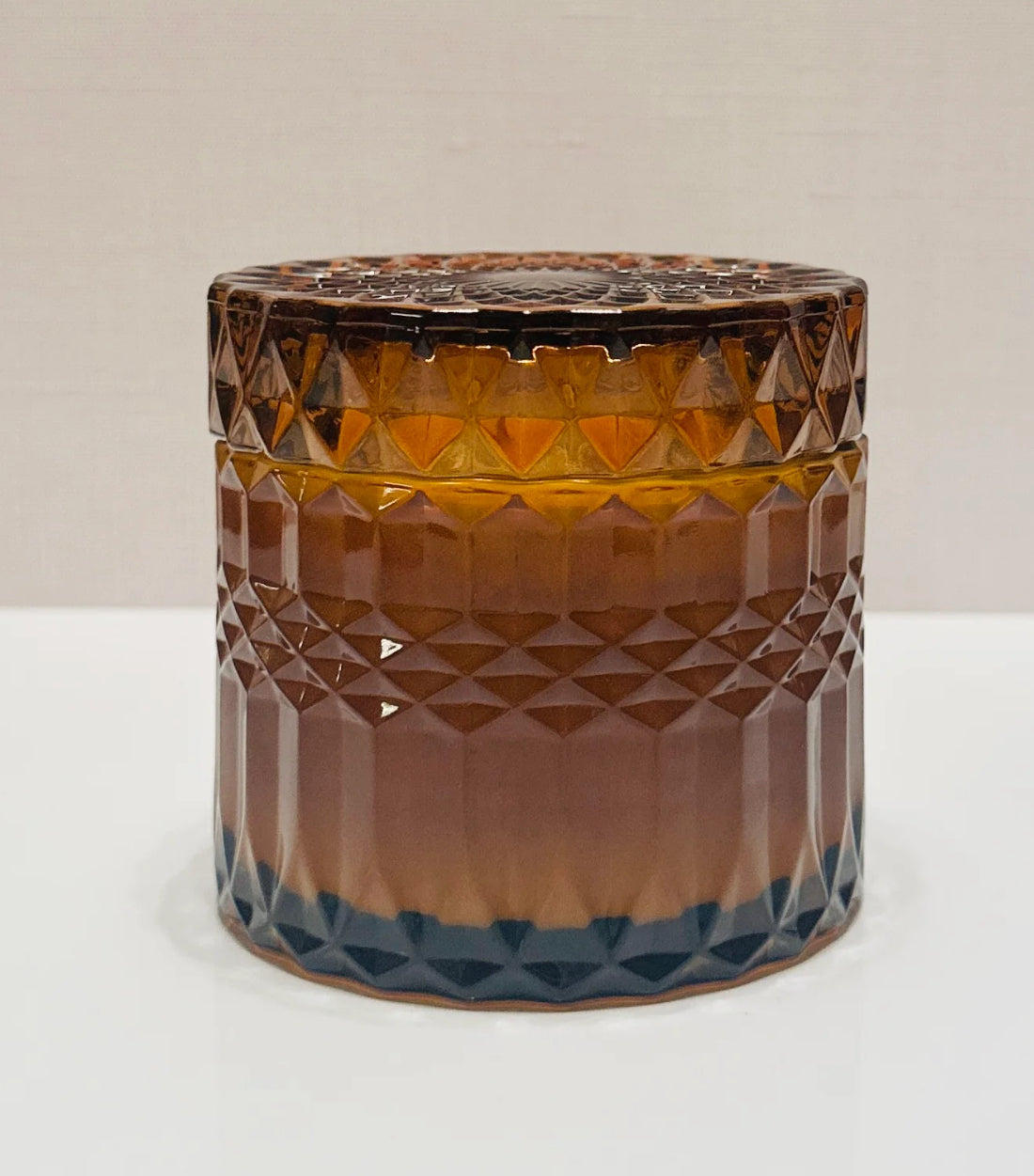 Brown glass jar with diamond pattern on a white background soy candle from Lumiere de Bougie candles