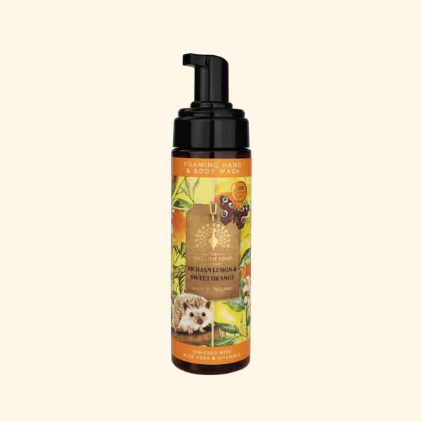 Hand and body wash bottle with a hedgehog illustration on an orange label against a white background