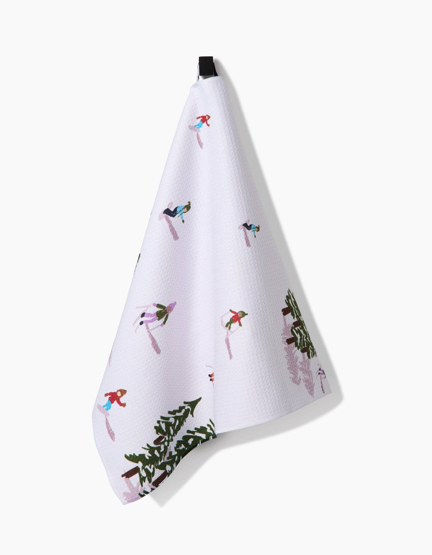 White towel with winter-themed designs on a white background