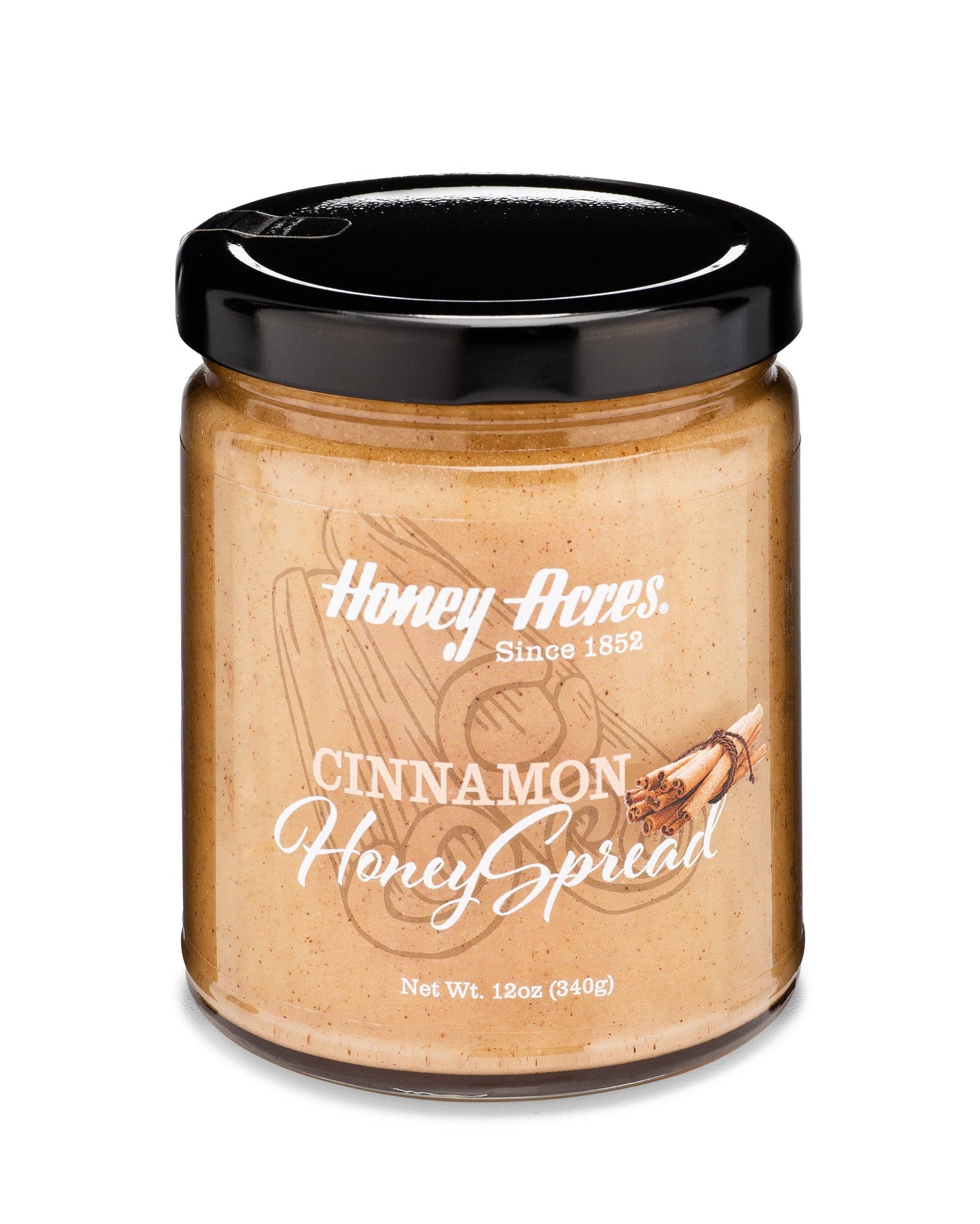 Jar of Honey Acres Cinnamon Honey Spread on a white background