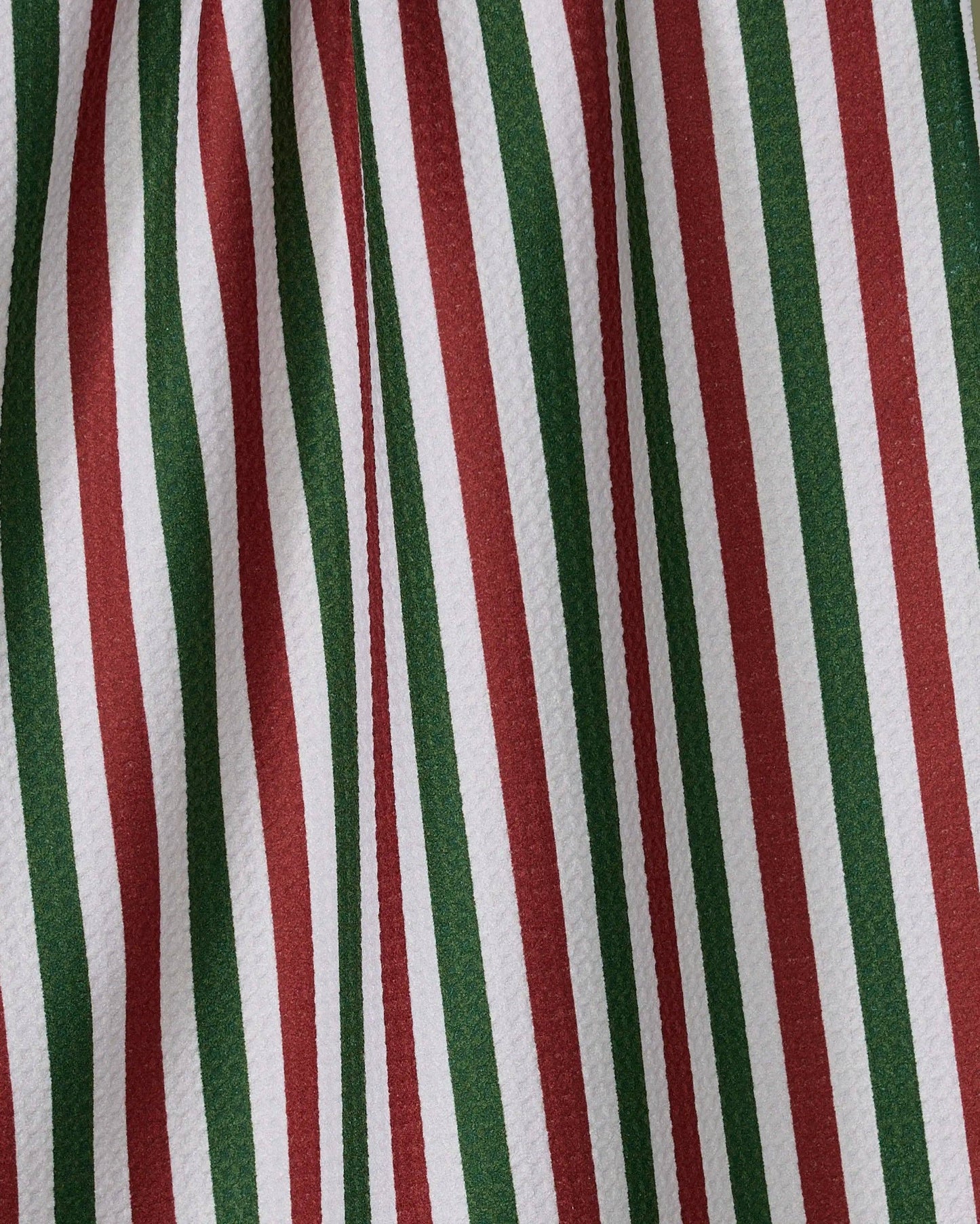 Geometry Tea Towel Ribbon Green Red Close-up of fabric with red, green, and white vertical stripes.