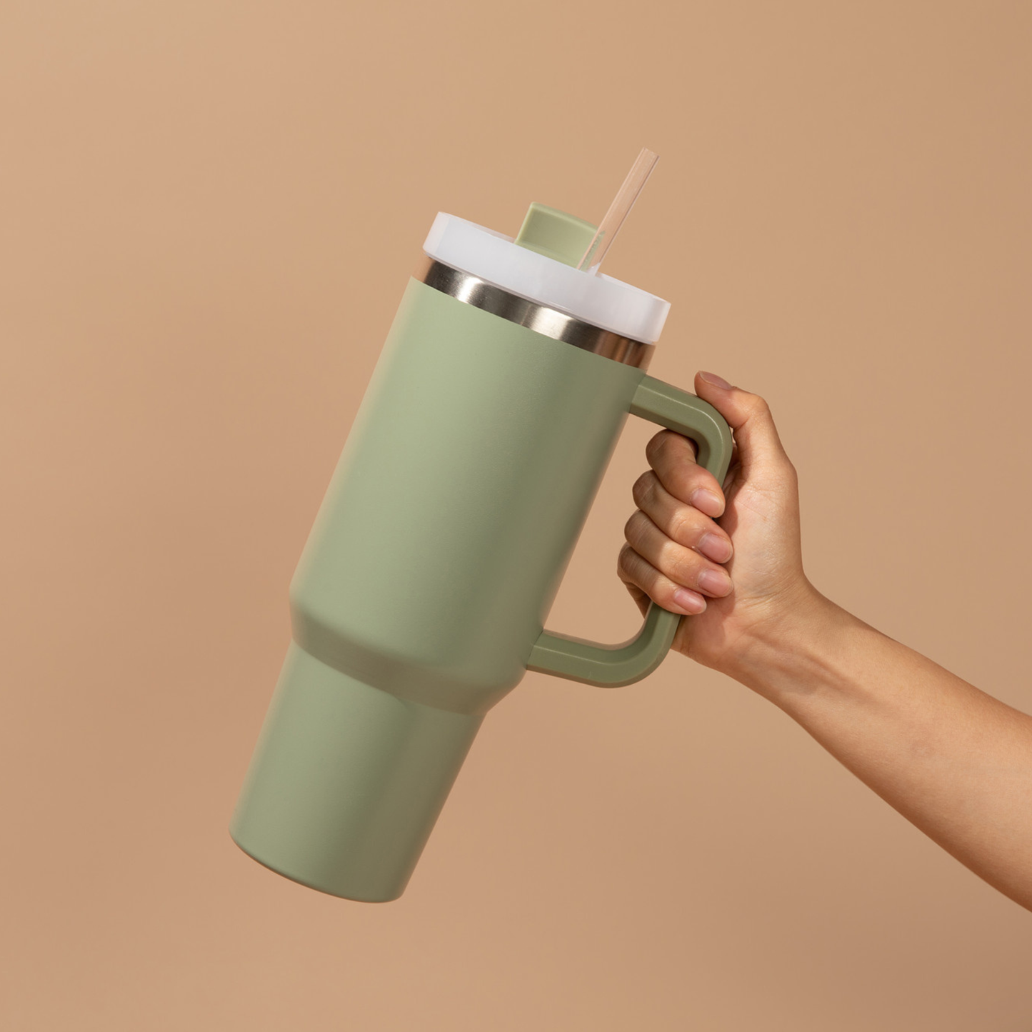 Green tumbler with beige background