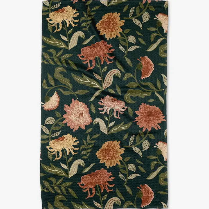 Floral patterned Geometry Tea Towel with flowers and leaves on a dark green background