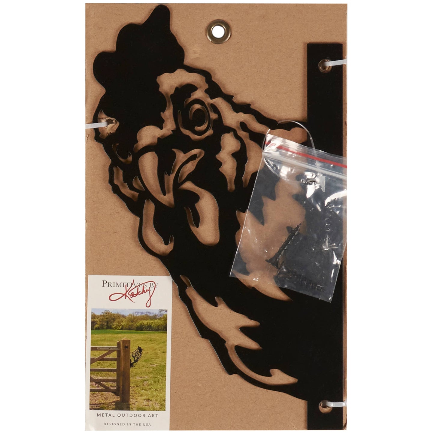 Metal wall art of a cowboy head on a cardboard backing with a clear plastic bag containing screws.