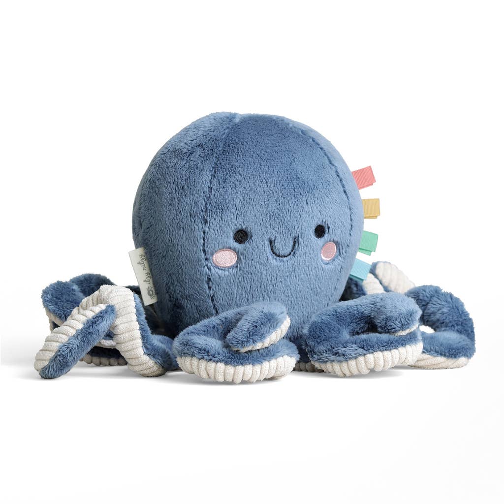 Blue plush octopus toy with a smiling face on a white background