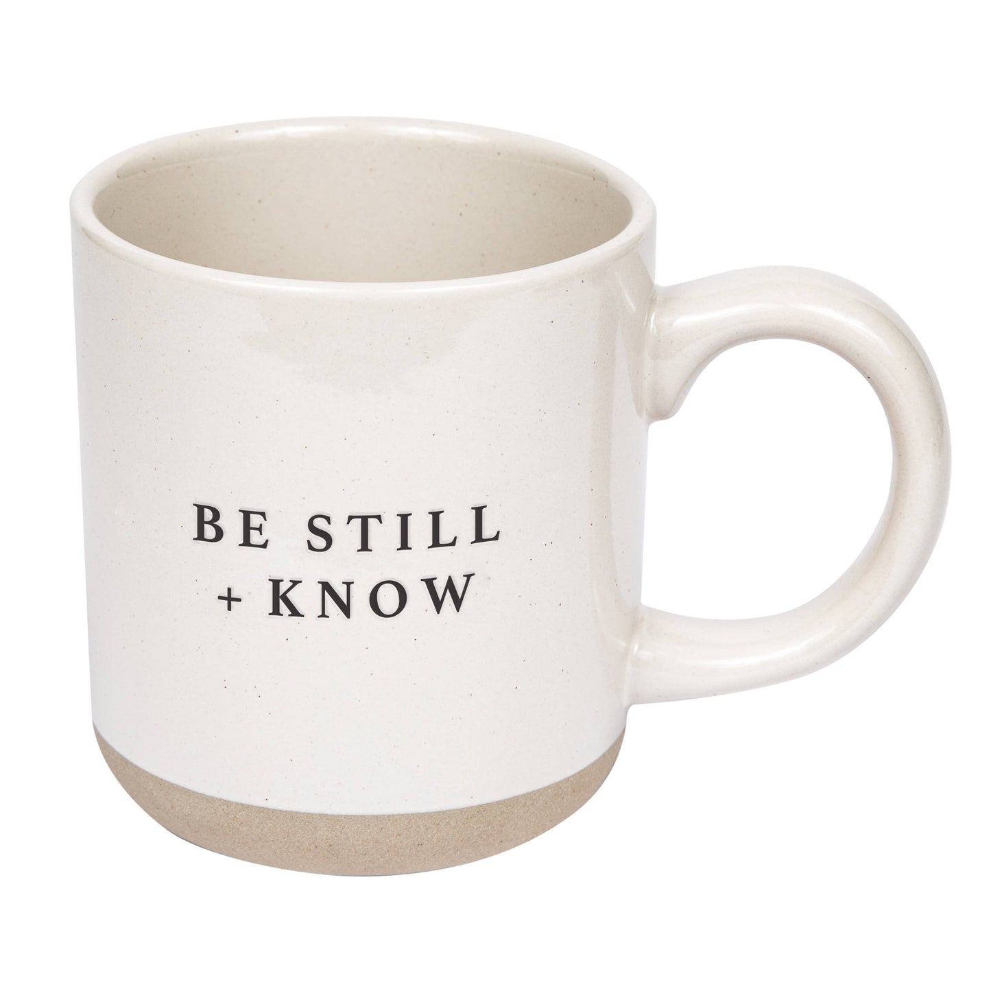 White mug with 'BE STILL + KNOW' text on a white background