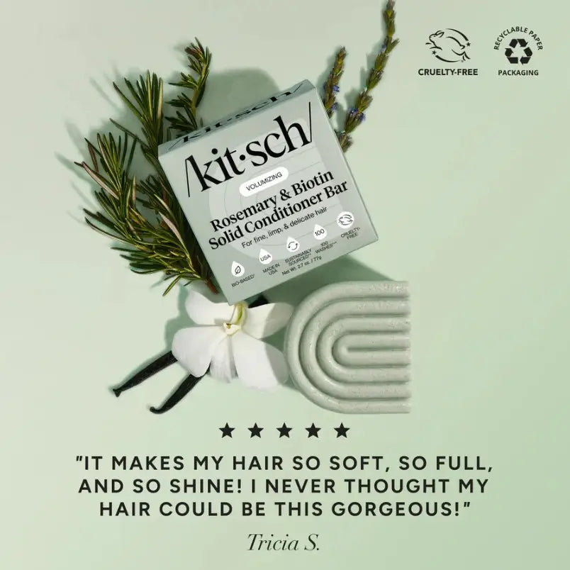 Kit'sch Rosemary & Biotin Solid Conditioner Bar with packaging and decorative elements on a light green background.