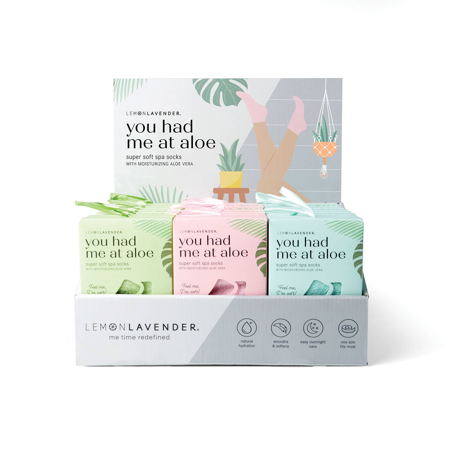Display of 'you had me at aloe' product boxes with colorful packaging.