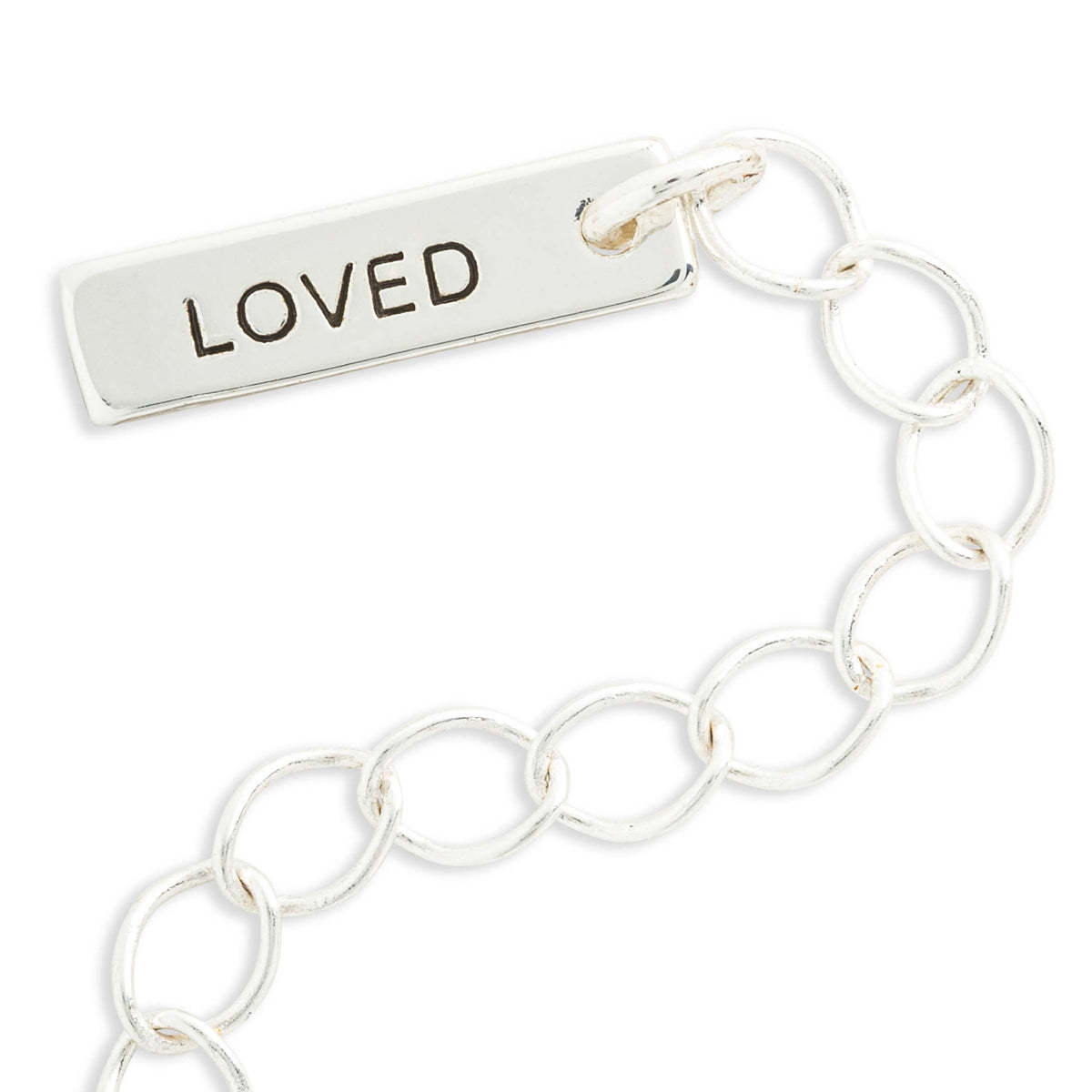 Silver chain with a rectangular tag that says 'LOVED' on a white background