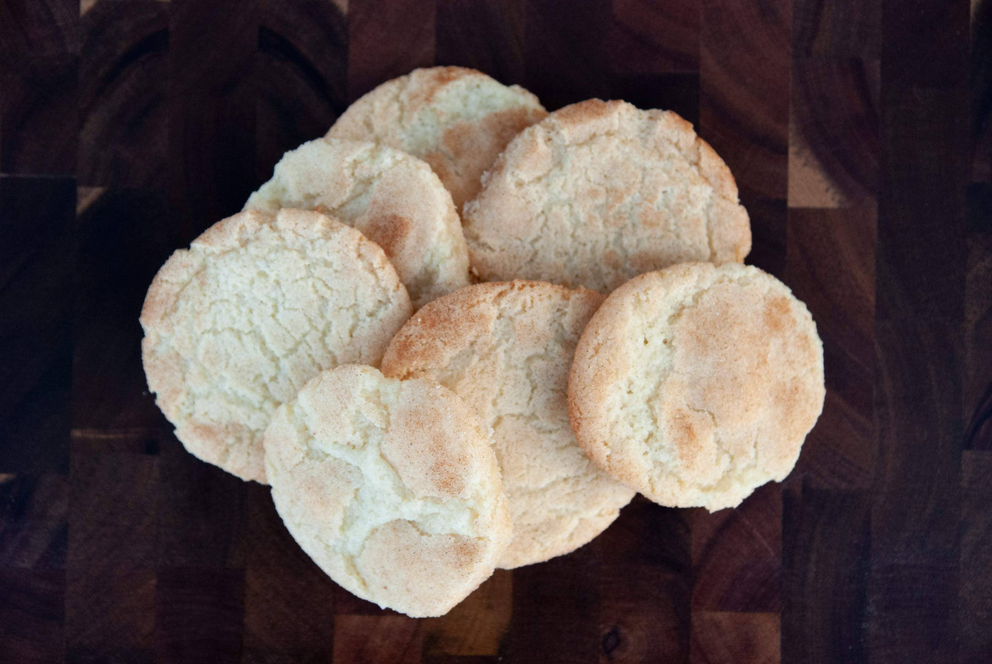 Stack of round cookies on a dark surface