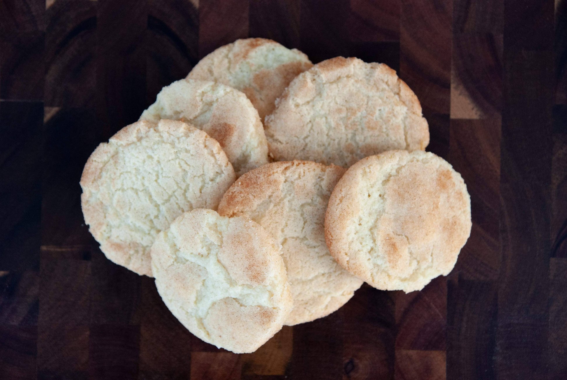 Stack of round cookies on a dark surface