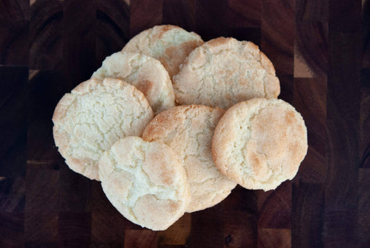 Stack of round cookies on a dark surface