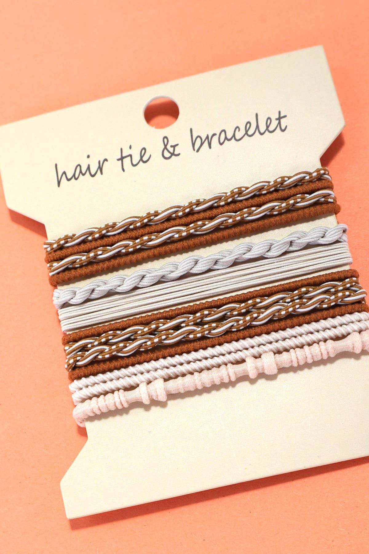 Four Boho-style knot hair tie bracelets displayed on cards, intended for both hair tie and wrist wear purposes, with varying colors and patterns.