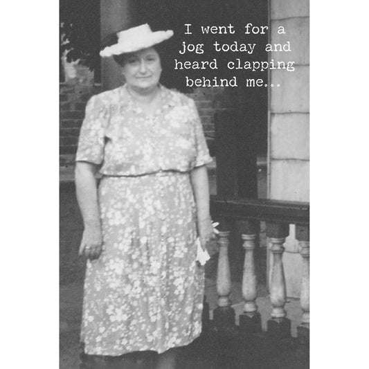 Black and white photo of a woman in a dress and hat with text overlay.