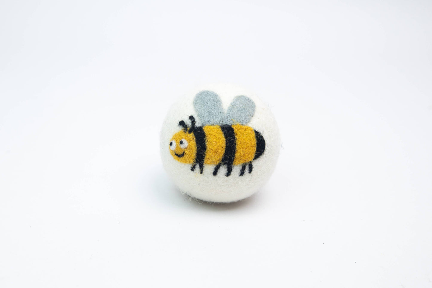 Wool Dryer Ball with bee on a white background