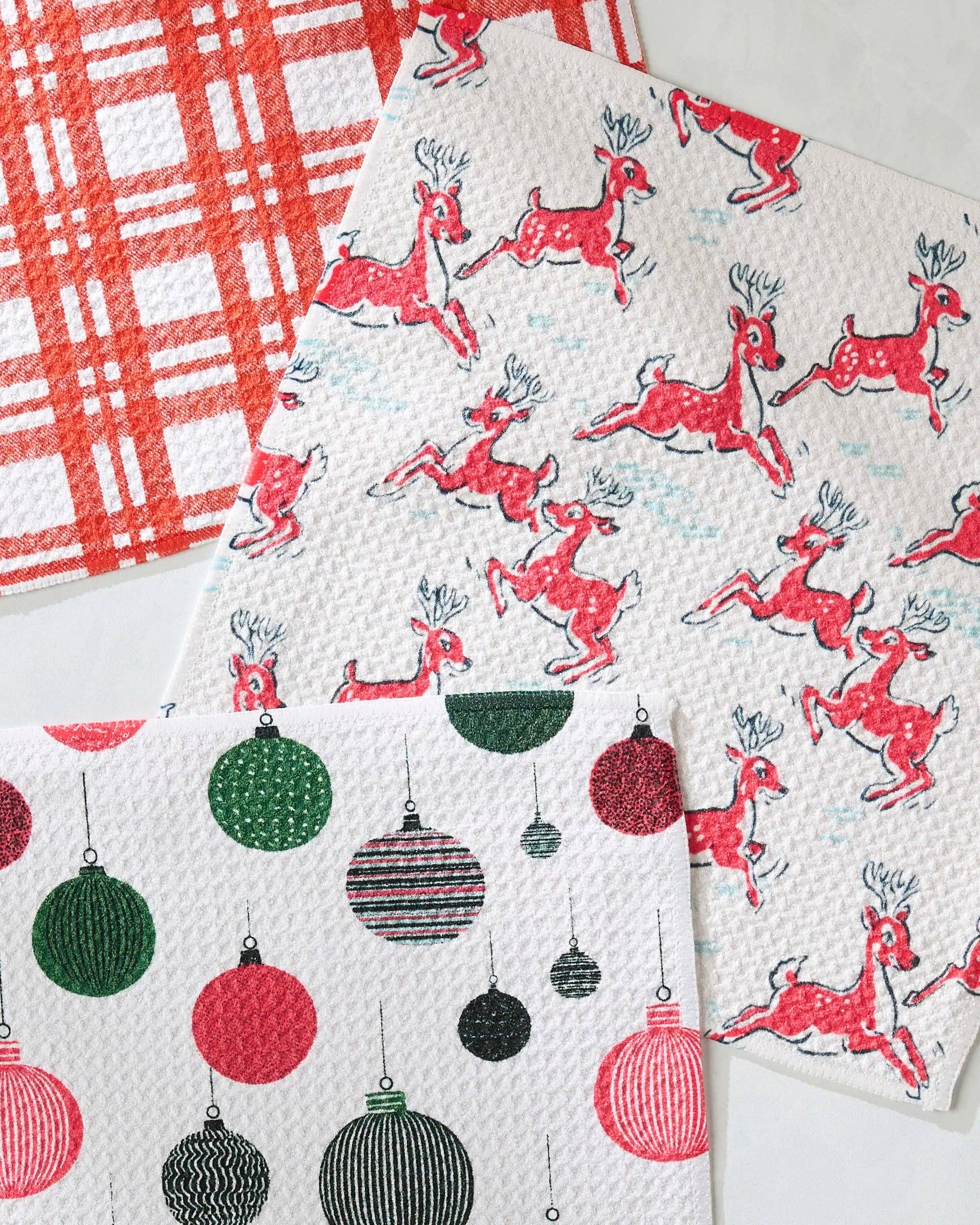 Geometry Dishcloth Set with reindeer and ornament patterns on a white background