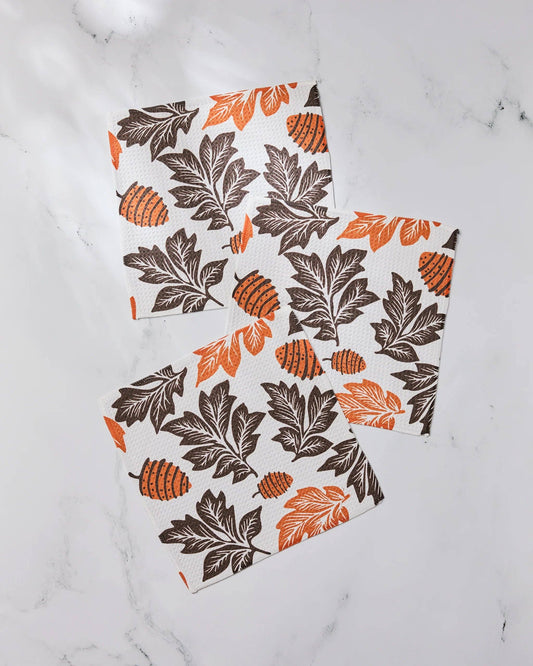 Set of three dishcloths with autumn leaf pattern on a marble surface Geometry Brand