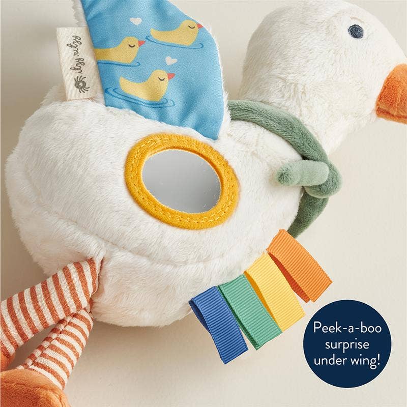 Plush toy with colorful elements and a duck design, featuring a 'peek-a-boo' surprise.