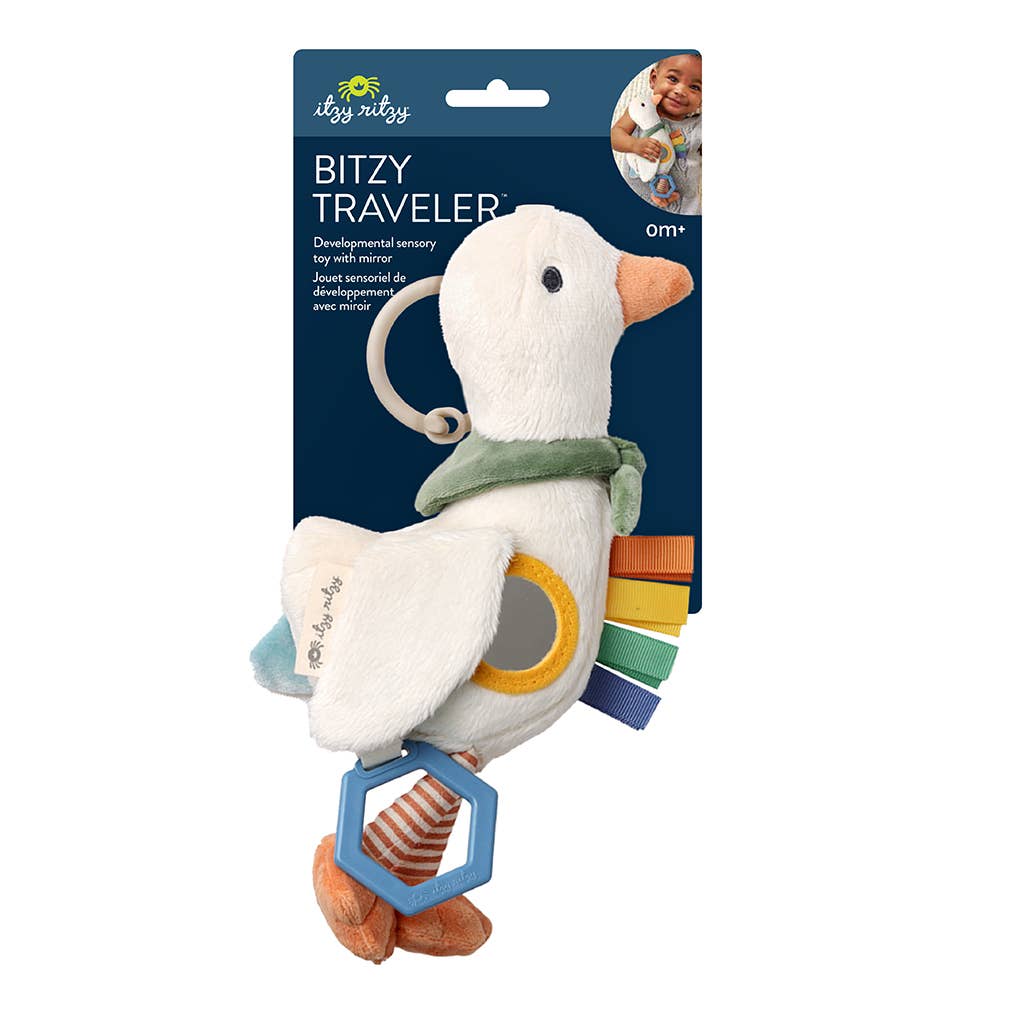 Plush toy with colorful accents in packaging, featuring the brand 'itzy'.