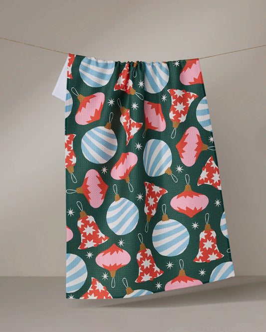 Colorful Christmas-themed Geometry Tea Towel with ornaments on a green background