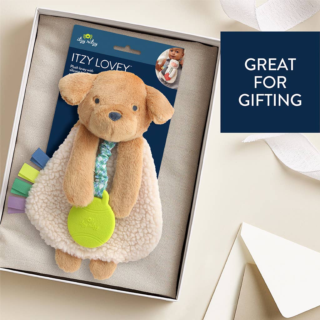 Dog-shaped Itzy Lovey toy in packaging with text 'Great for gifting' on a light background