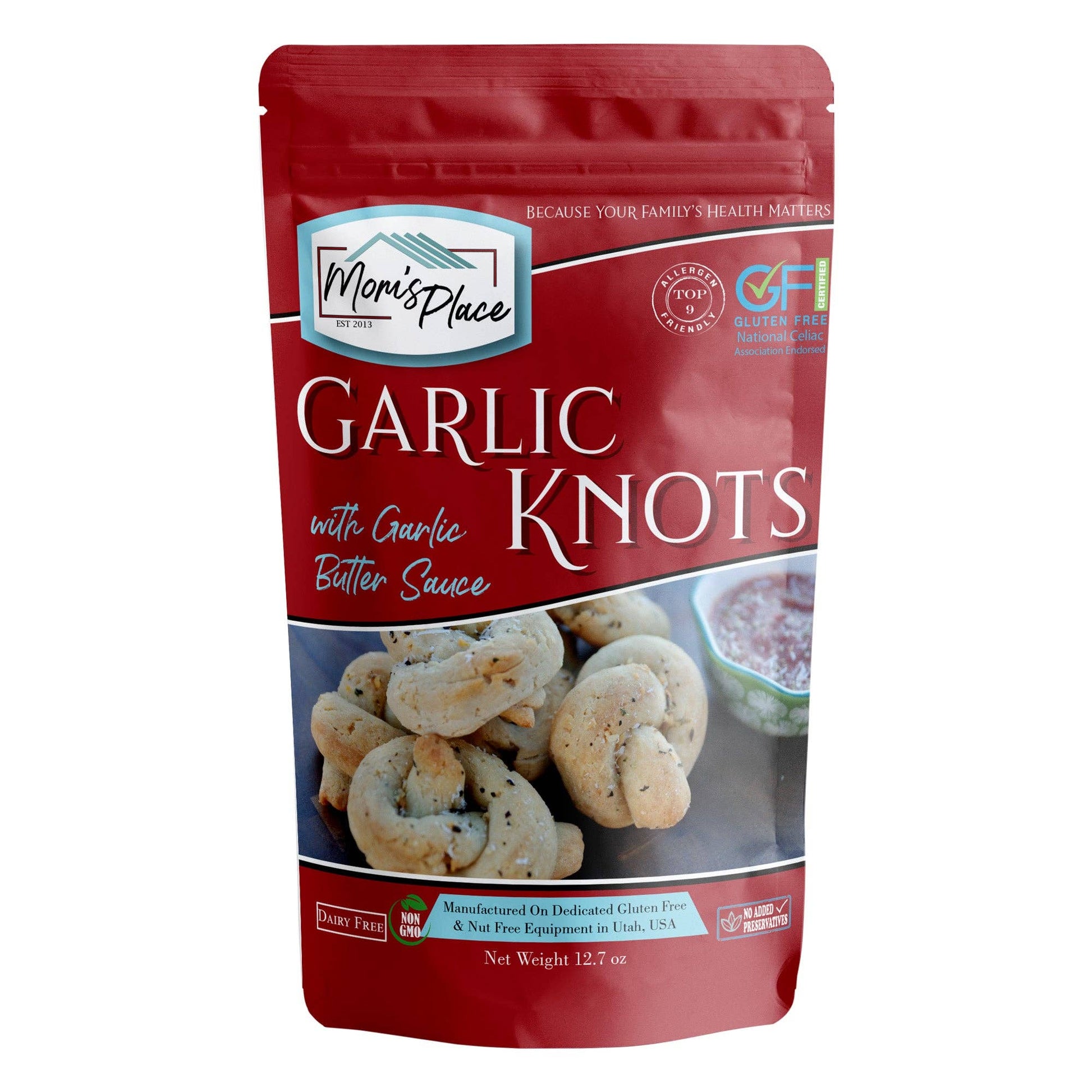 Packaging of Mom's Place Garlic Knots with Garlic Butter Sauce on a white background