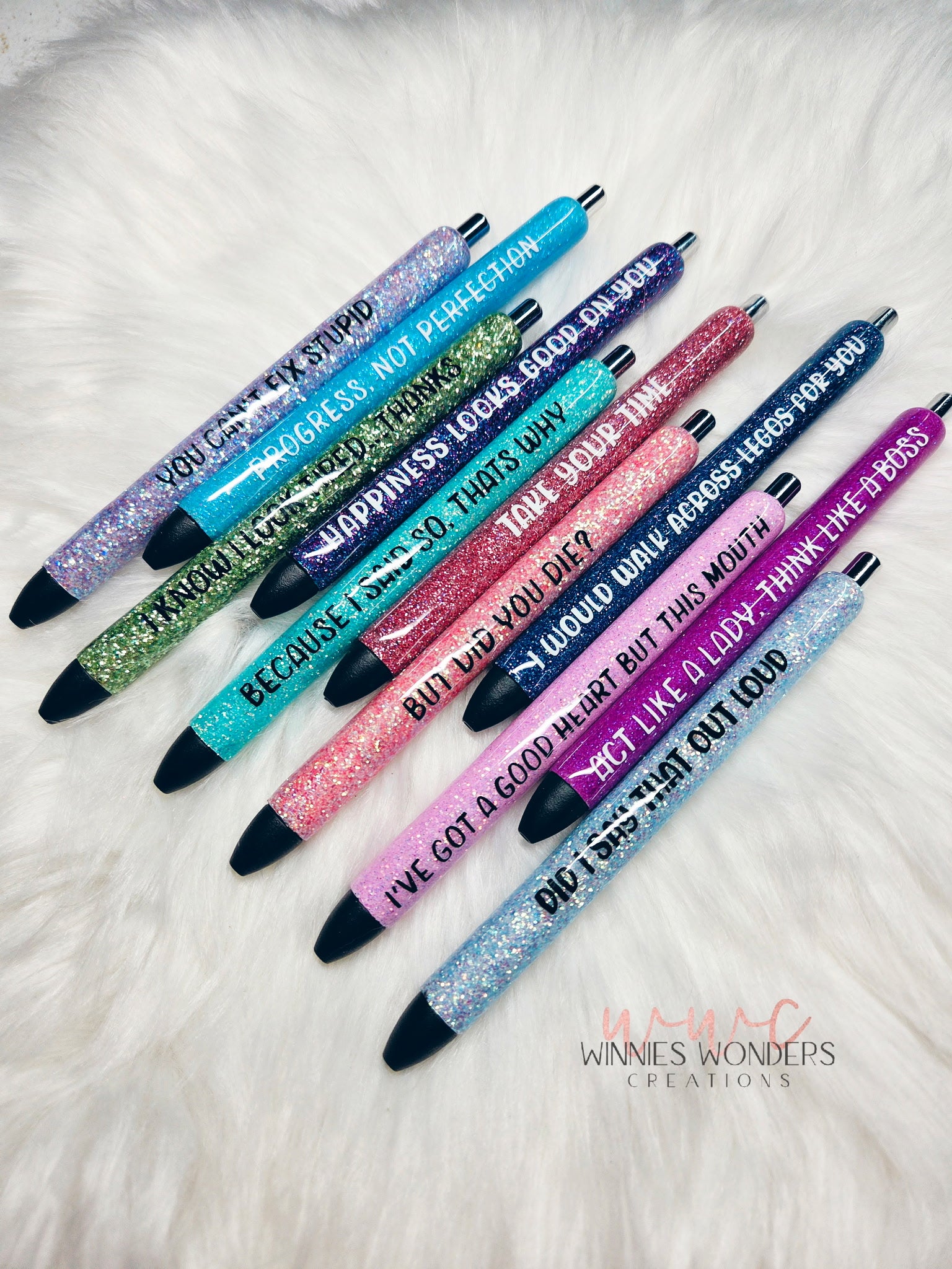 Set of glittery pens with motivational text on a white surface Winnies Wonders Creations