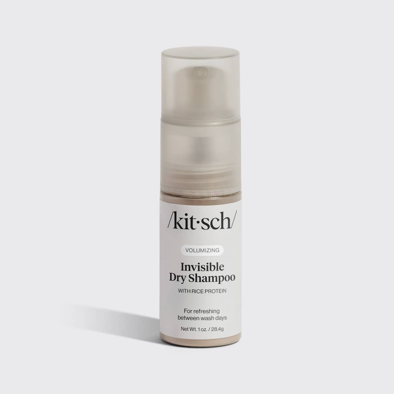 The image shows a packaged and pump bottle of Kitsch Volumizing Invisible Rice Protein Dry Shampoo, indicating it is for refreshing between wash days.