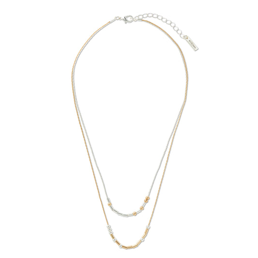 A double-strand necklace featuring one silver-tone chain and one gold-tone chain, with small bead accents and a silver clasp, displayed on a clean white background and beads say You're Strong in Morse Code.