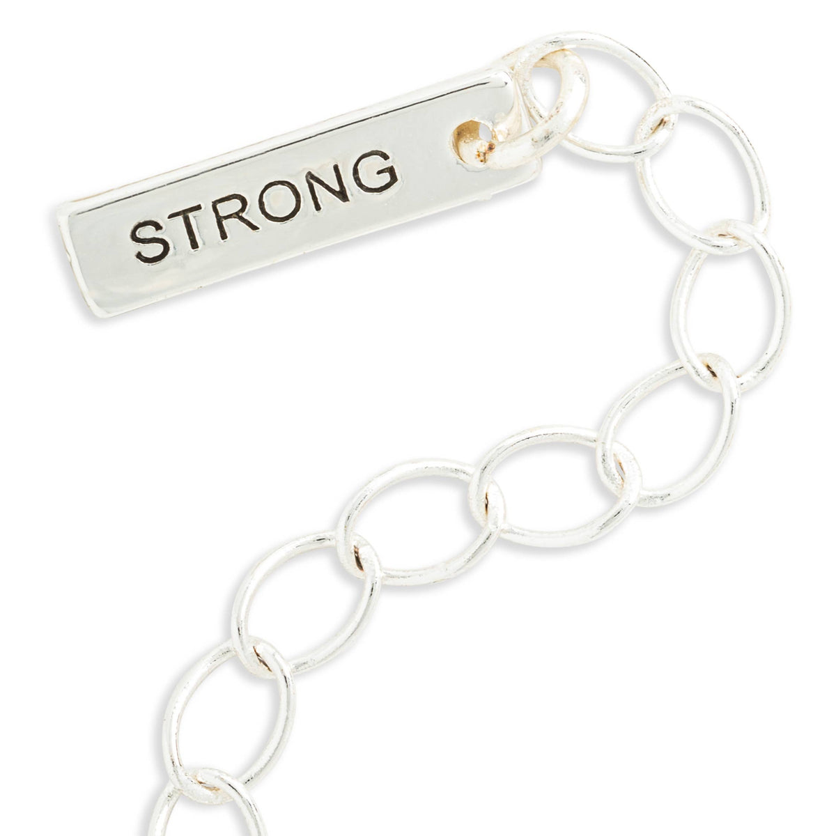 A close-up of a silver-toned chain bracelet with a rectangular bar charm engraved with the word 'STRONG' in dark lettering, on a plain white background.