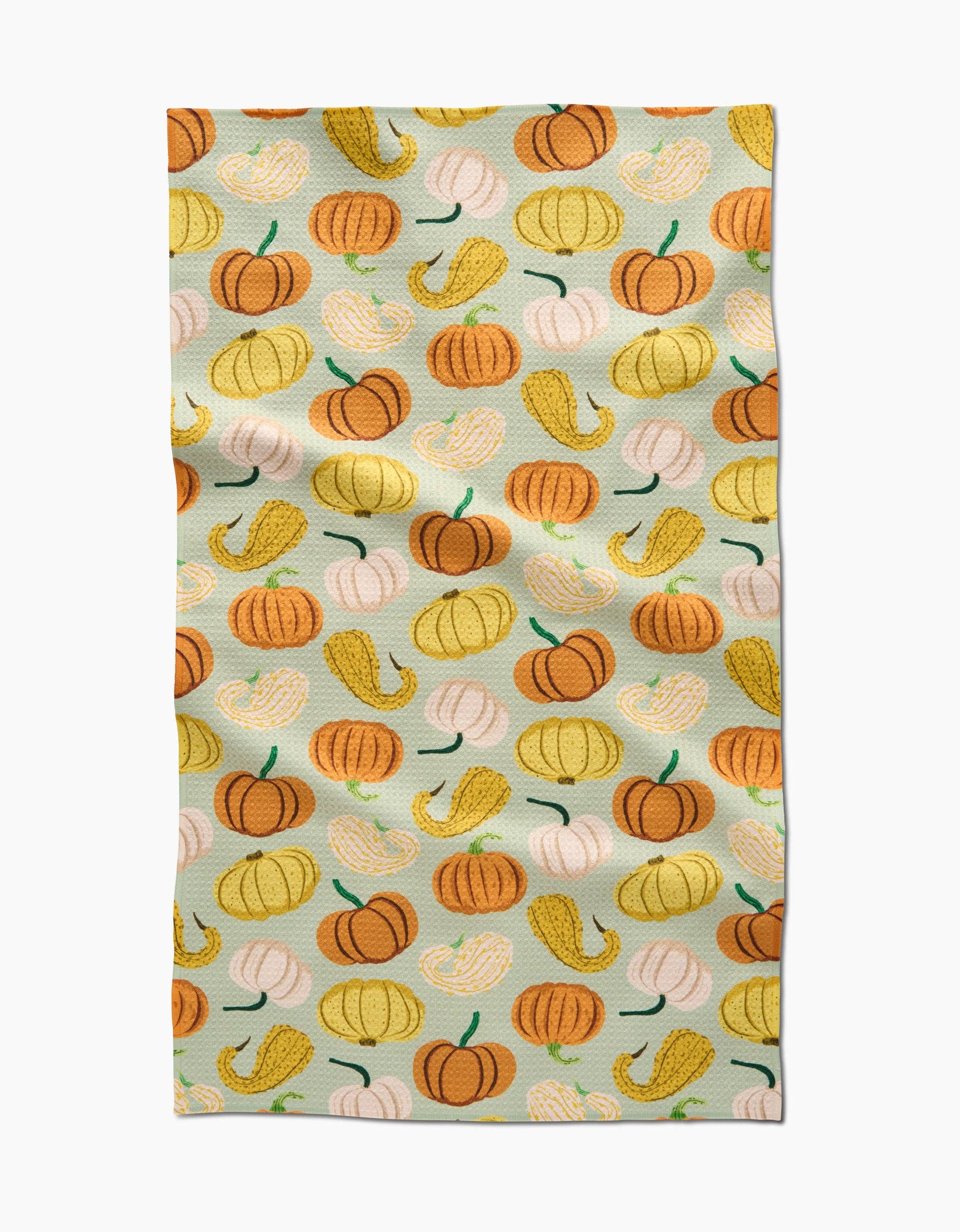 Tea towel with colorful pumpkin pattern on a light blue background