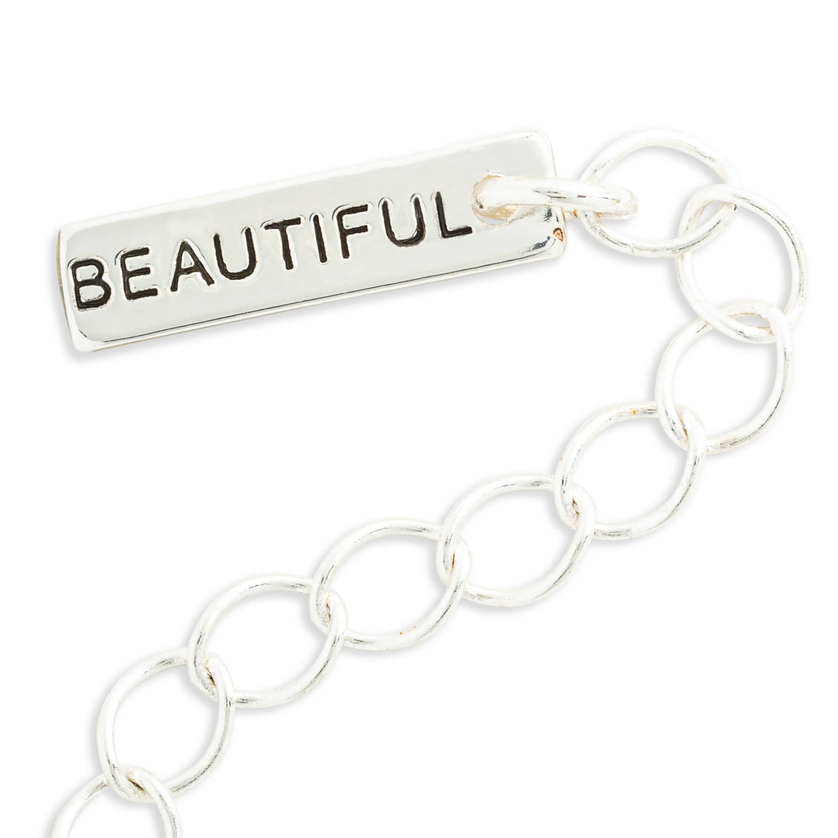 A silver chain bracelet featuring a rectangular bar engraved with the word 'BEAUTIFUL' in black capital letters, shown on a plain white background.