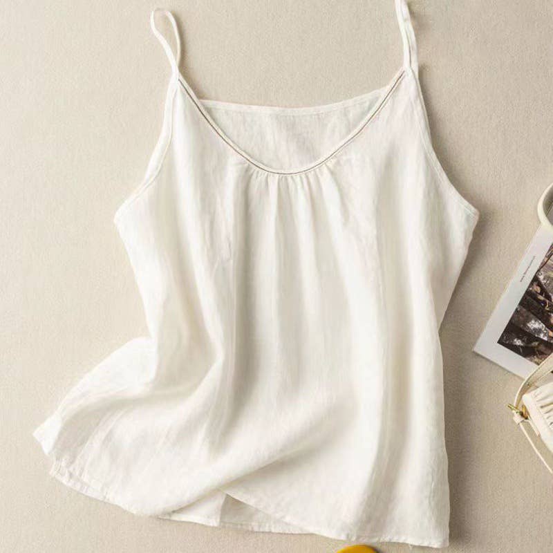 White satin camisole on a beige background