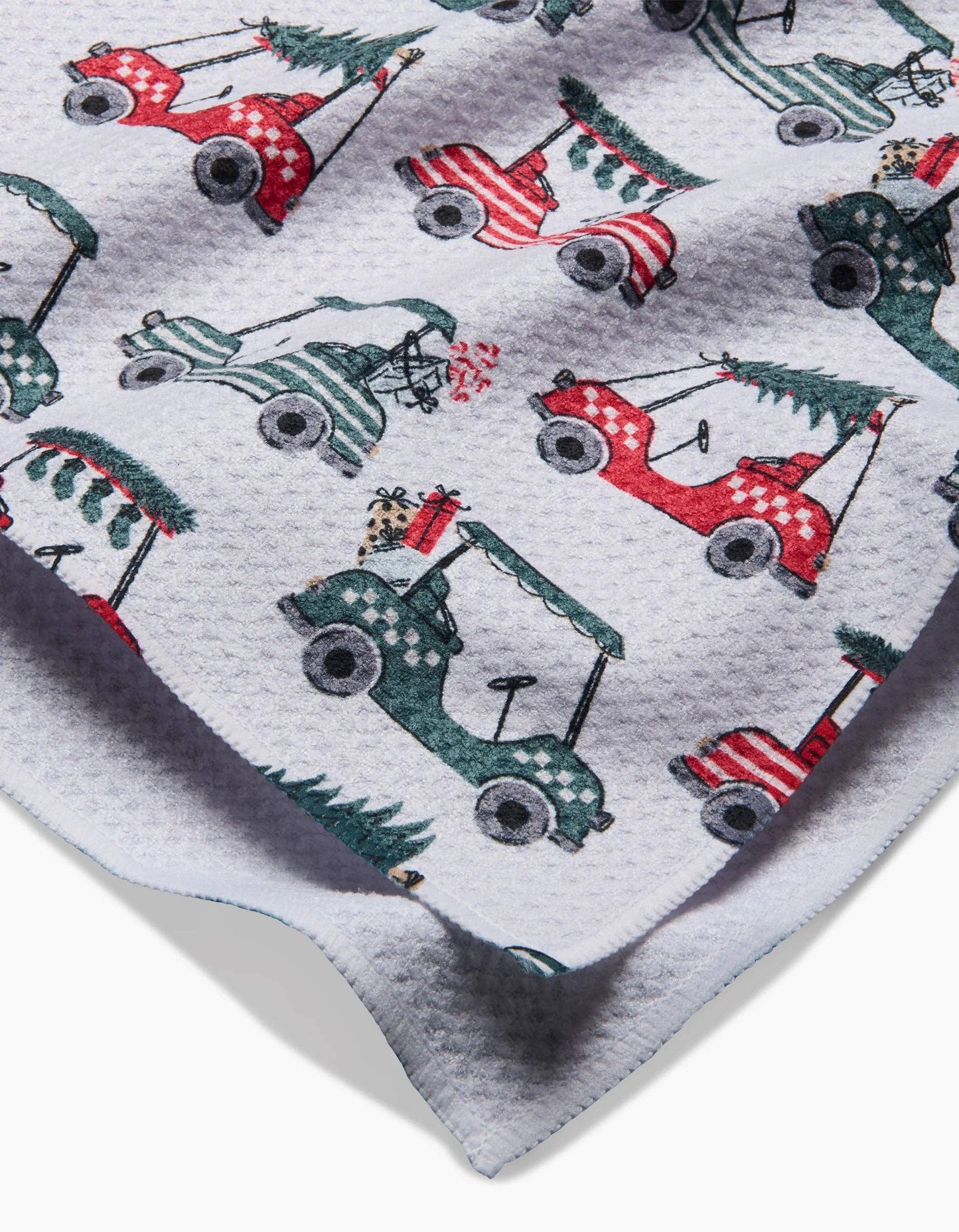 Geometry Tea Towel Patterned fabric with golf carts and trees on a gray background