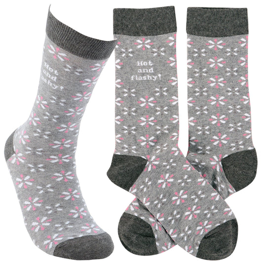 Three pairs of gray socks with floral pattern and text on a white background