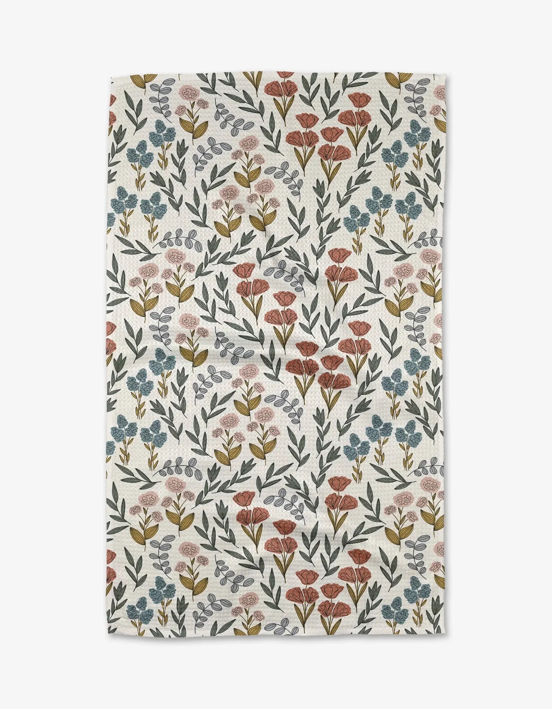 Floral patterned towel with small flowers on a white background