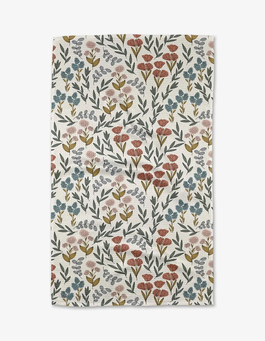 Floral patterned towel with small flowers on a white background