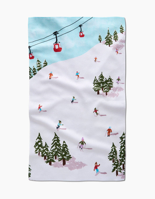 Ski resort scene with people skiing and a ski lift on a white background
