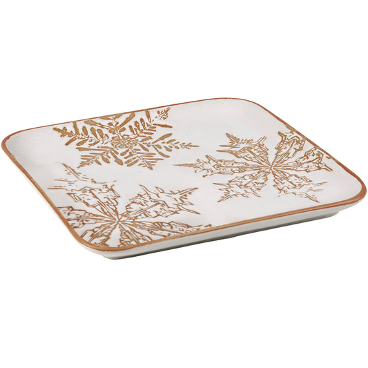 Square ceramic plate with snowflake design on a white background